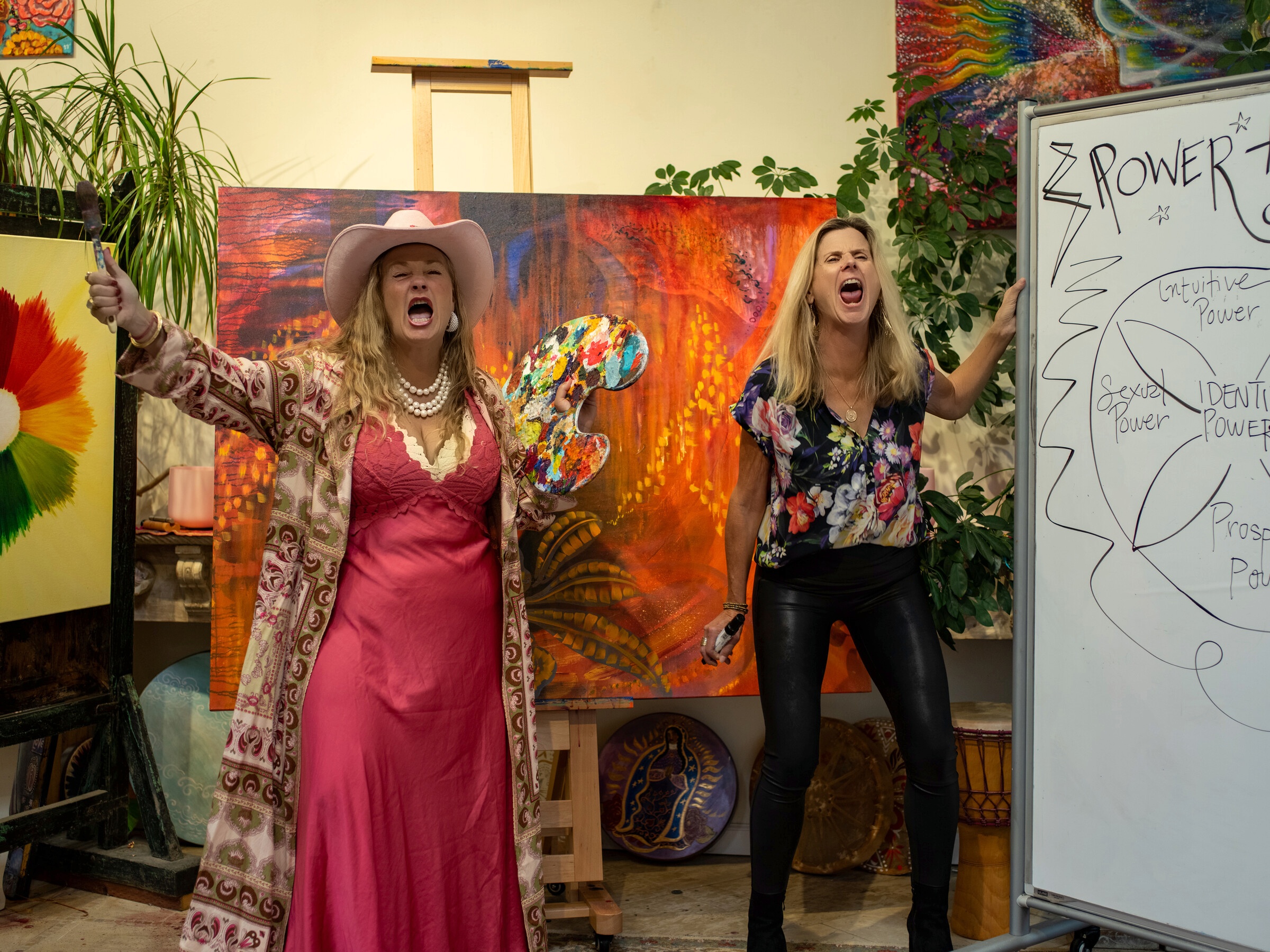 Shiloh Sophia and Amy Ahlers roaring with joy in Shiloh's art studio
